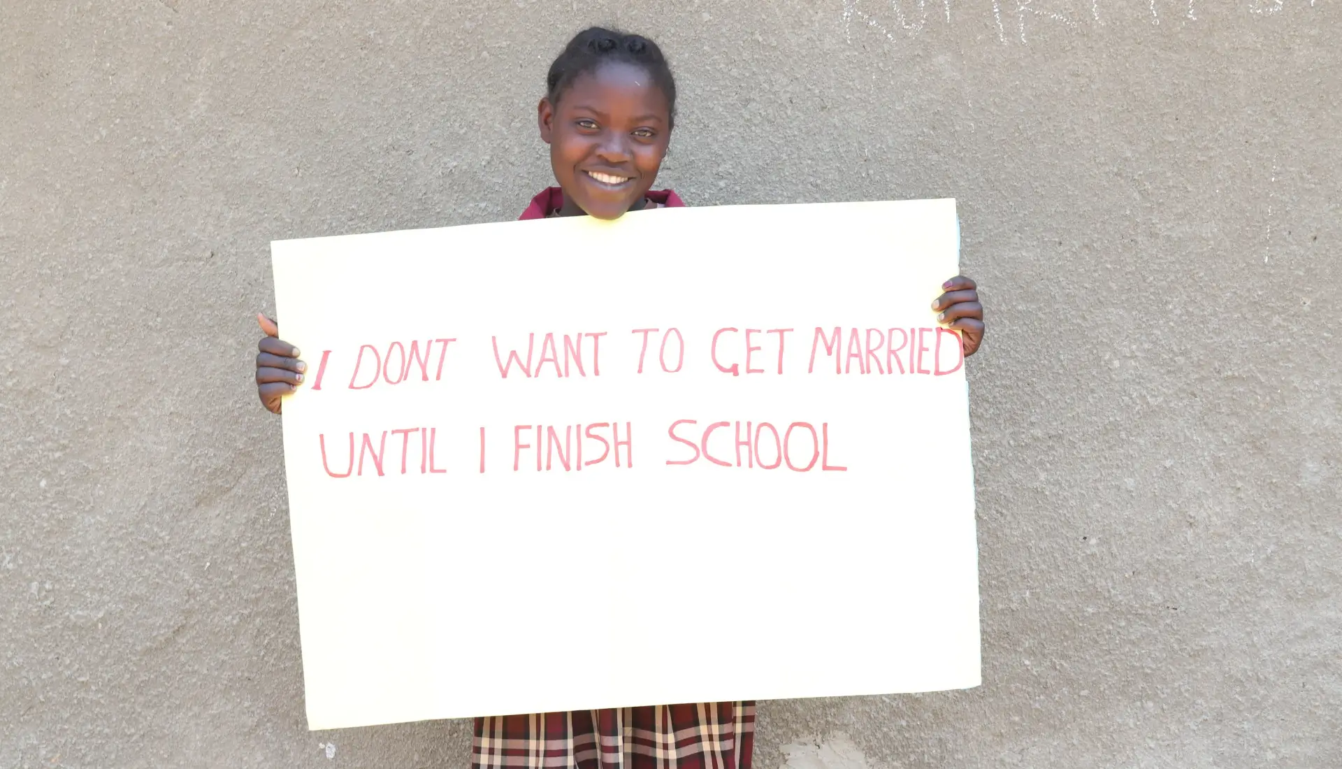 The girls carried placards with messages on child protection.