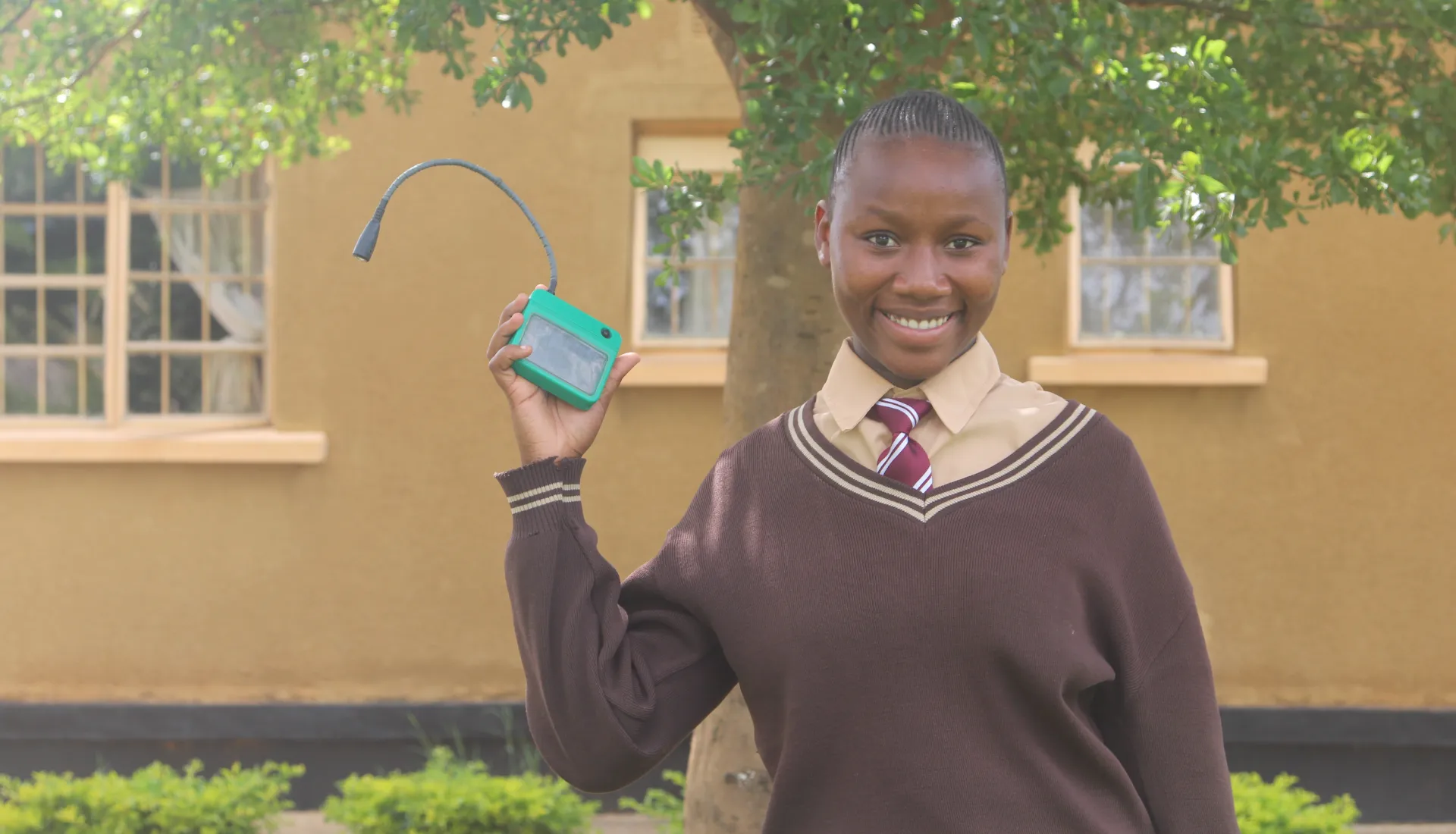 A learner from Chibombo shows one of the donated solar lights.