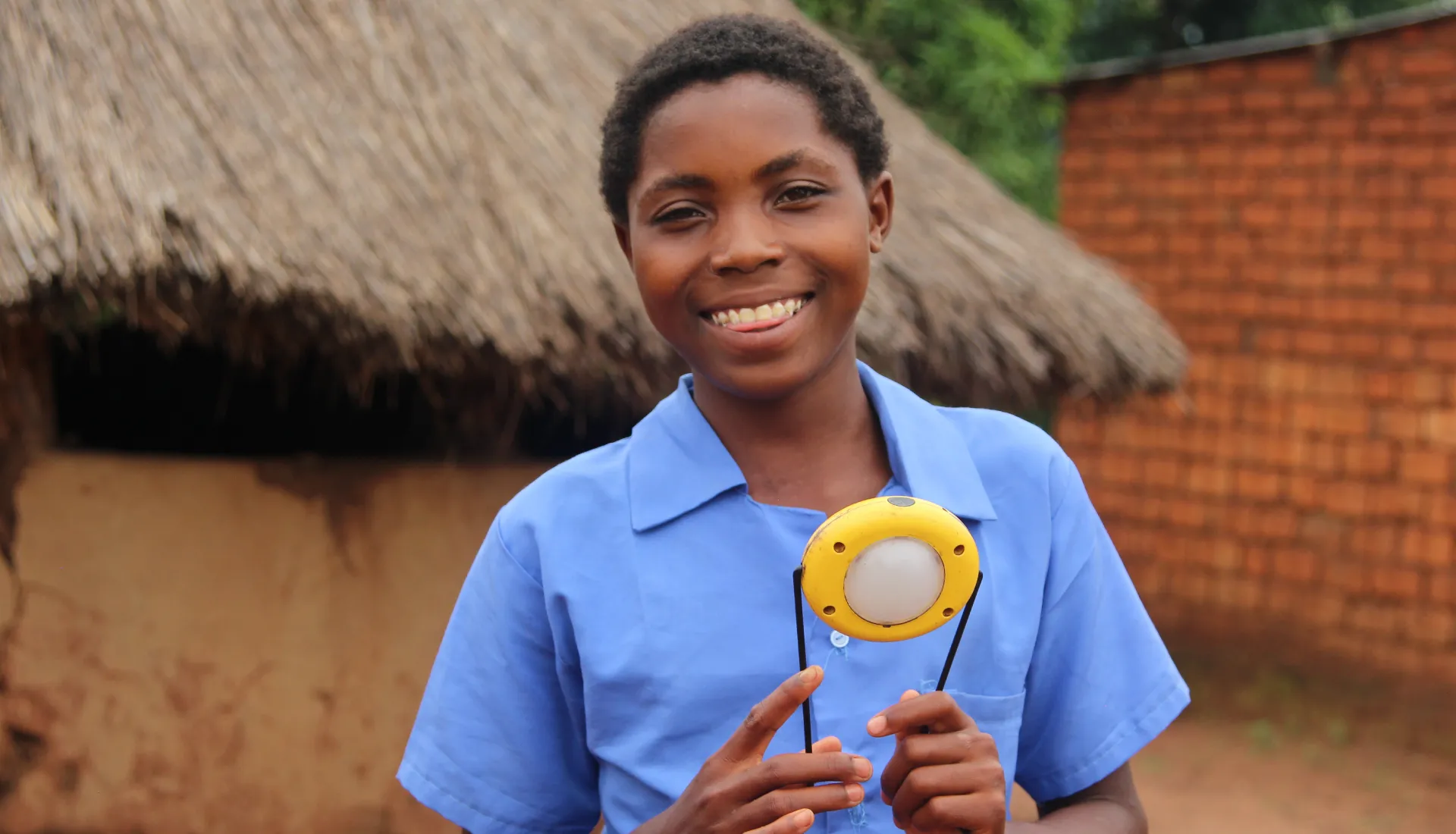 Fainess showing off her solar light.