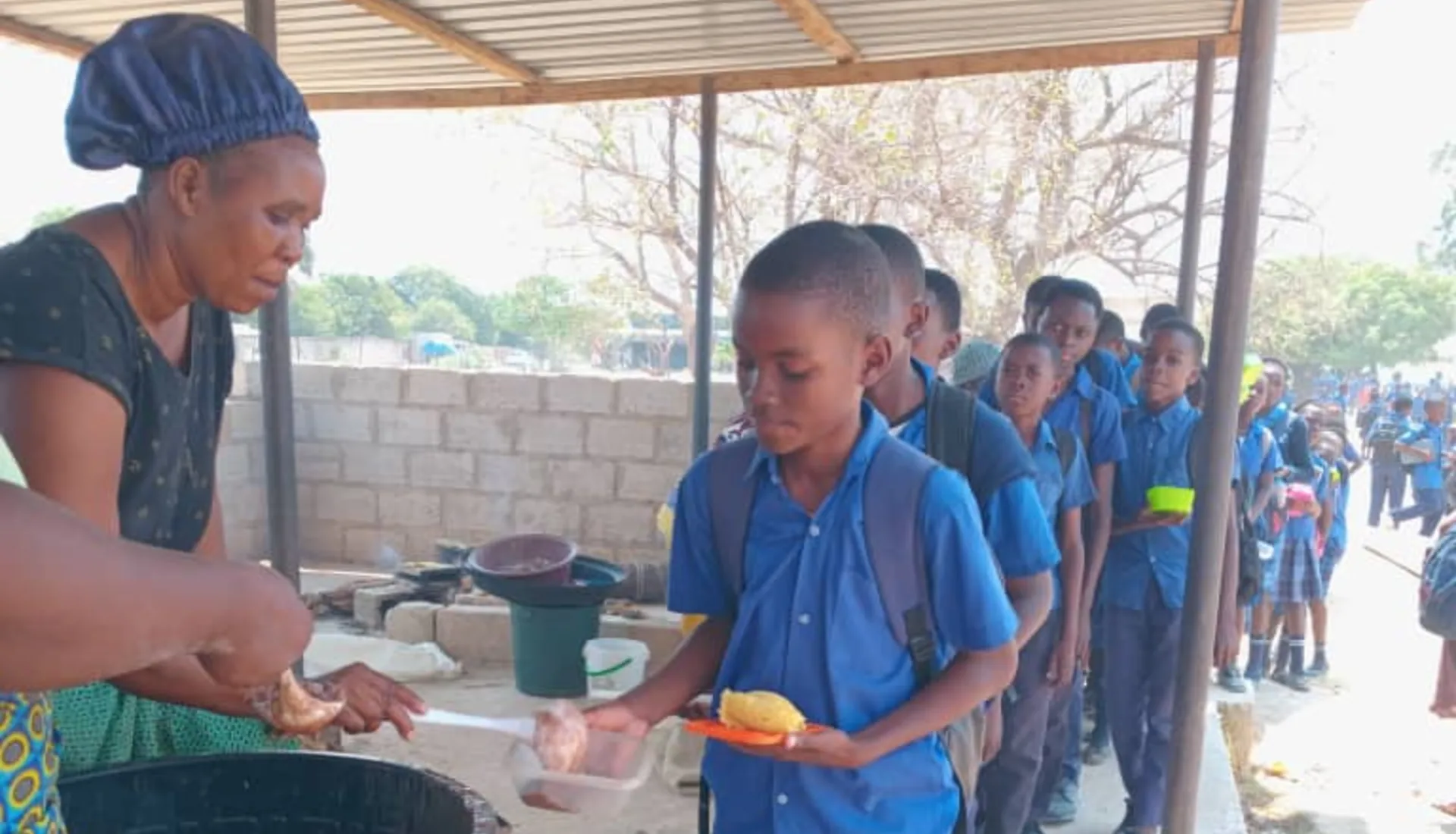 Children at one of the participating schools in Lusaka receiving the meals